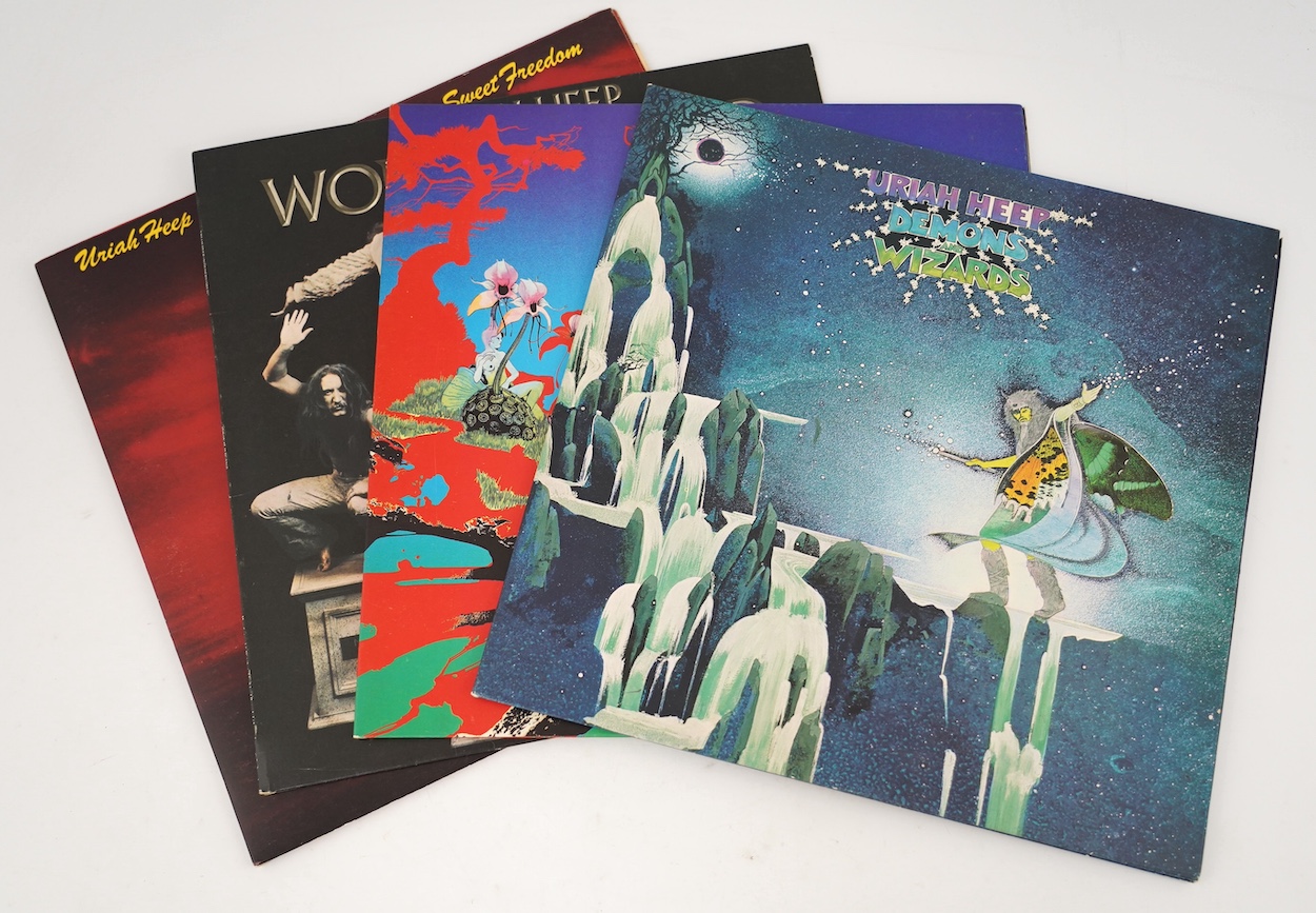 Four Uriah Heep LP record albums; Demons and Wizards, The Magician’s Birthday, Wonderworld, Sweet Freedom. Condition - fair to good, some scratches and wear etc., to playing surface